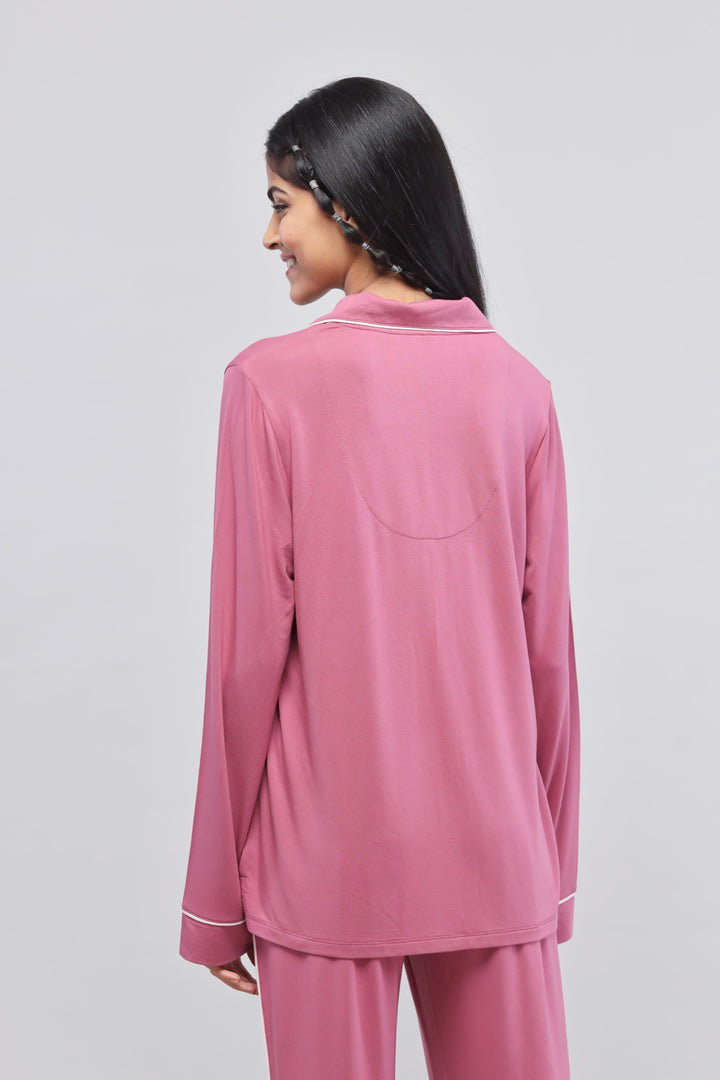 Rosy pink button-down top with full sleeves and piping details.