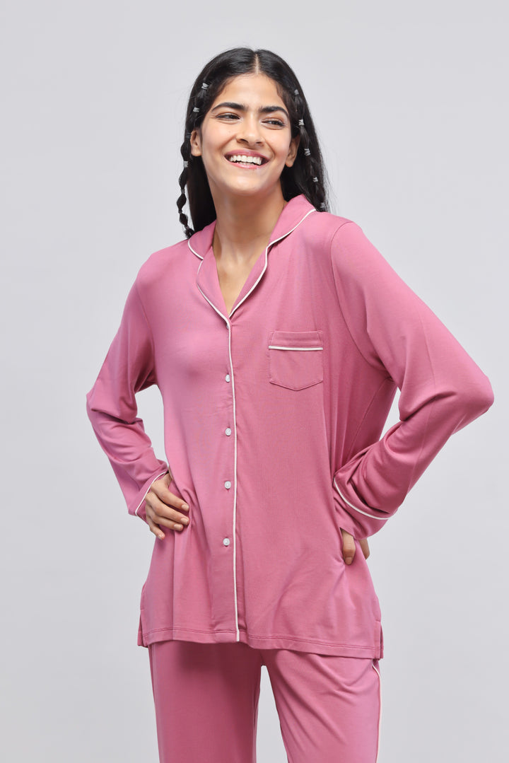 Rosy pink button-down top with full sleeves and piping detail.