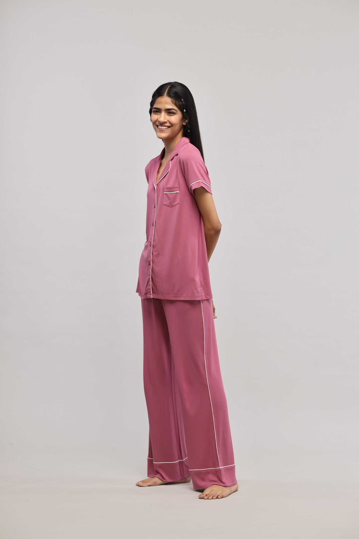 Rosy pink button-down piping pajama set with half-sleeve top.