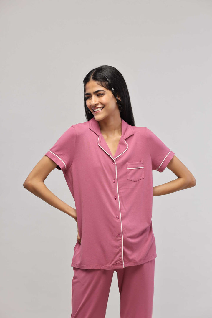 Rosy pink button-down half sleeve top with piping details.