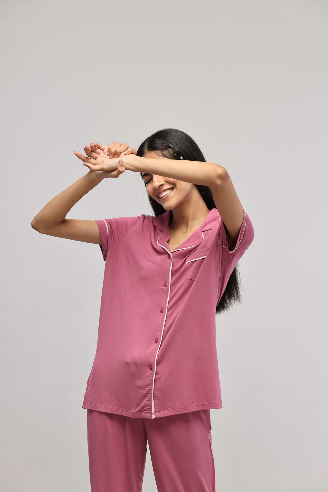 Rosy pink button-down top with half sleeves, perfect for casual wear.