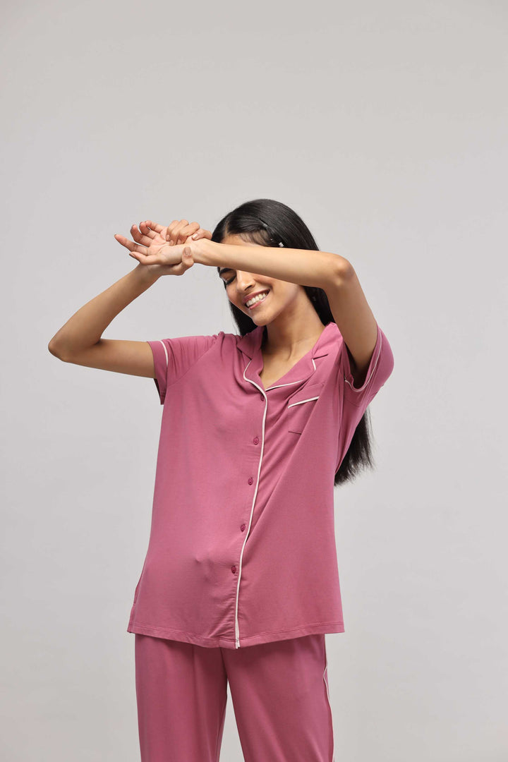 Rosy pink button-down top with half sleeves, perfect for casual wear.