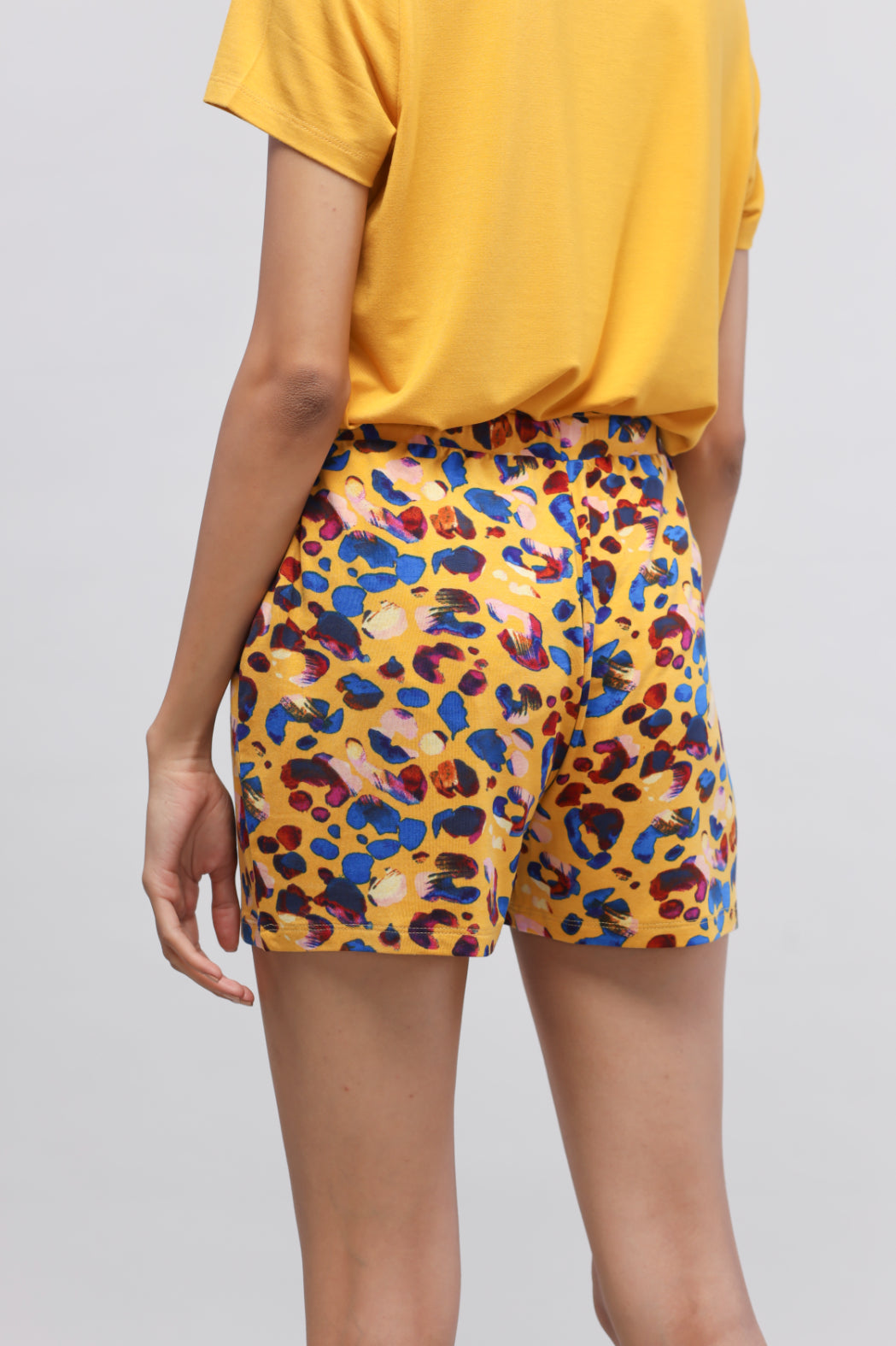 Brightly colored Safari Modal Shorts with a fun leopard print design.