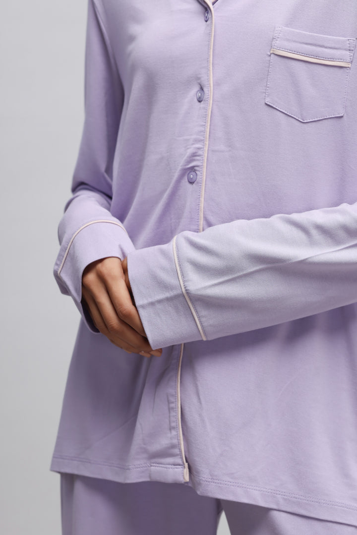 Lavender piping pajama set featuring full sleeve top and button details.