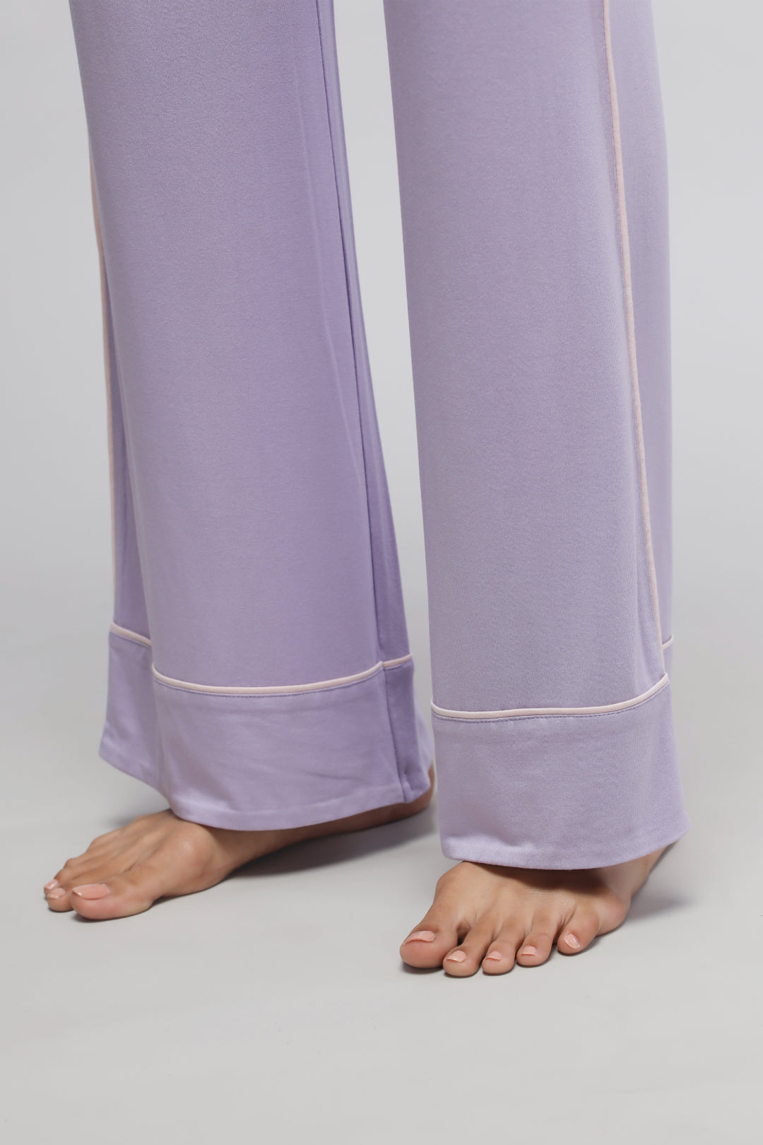 Lavender piping pajamas with comfortable, stylish wide-leg design.