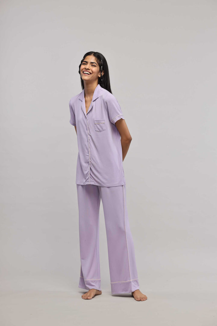 Lavender piping pajama set with half sleeve top, stylish and comfortable.