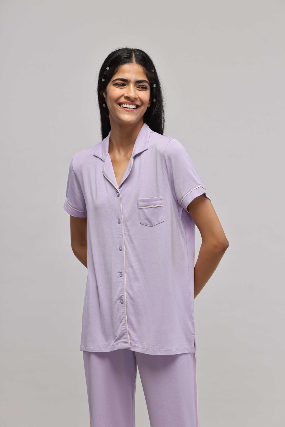 Lavender half-sleeve button-down top with piping detail.