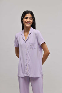 Lavender half-sleeve button-down top with piping detail.