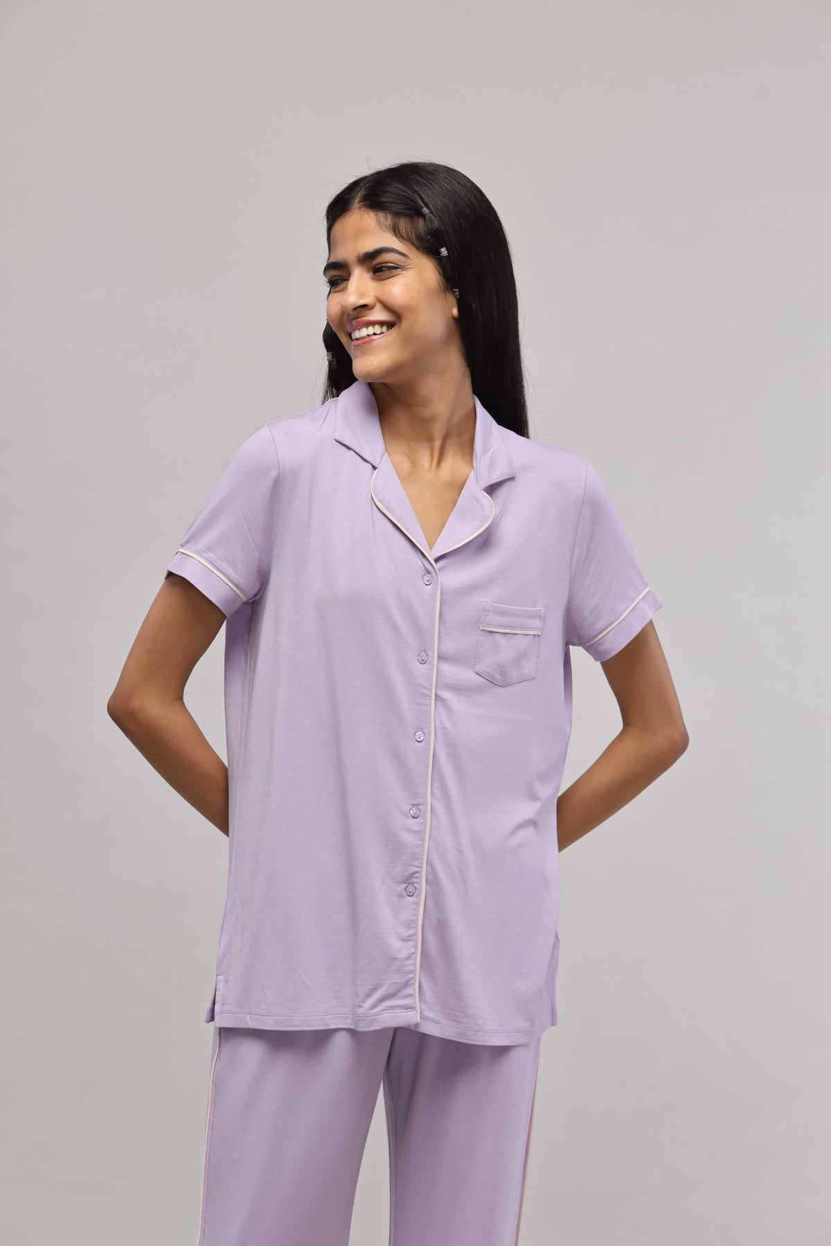 Lavender button-down half sleeve top with piping detail.