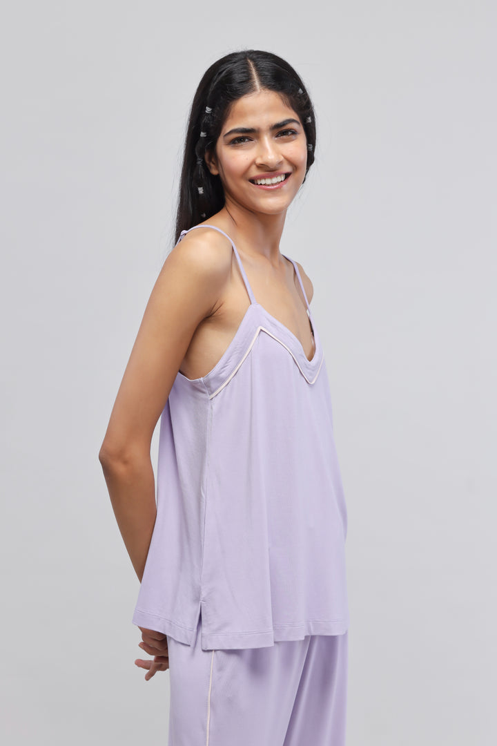 Lavender tank top worn by a smiling model.