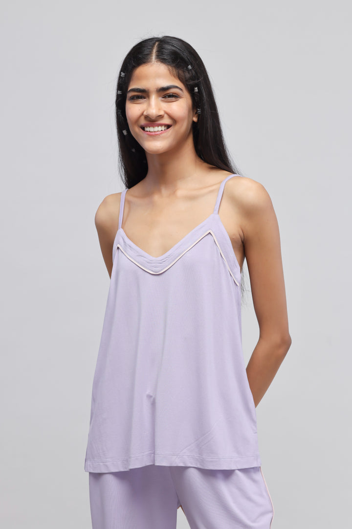 Lavender tank top on a model with a bright smile.