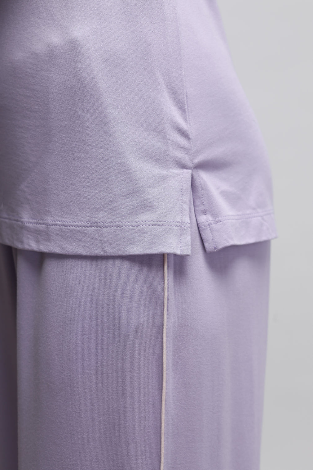 Lavender tank top showcasing soft fabric and stylish design.