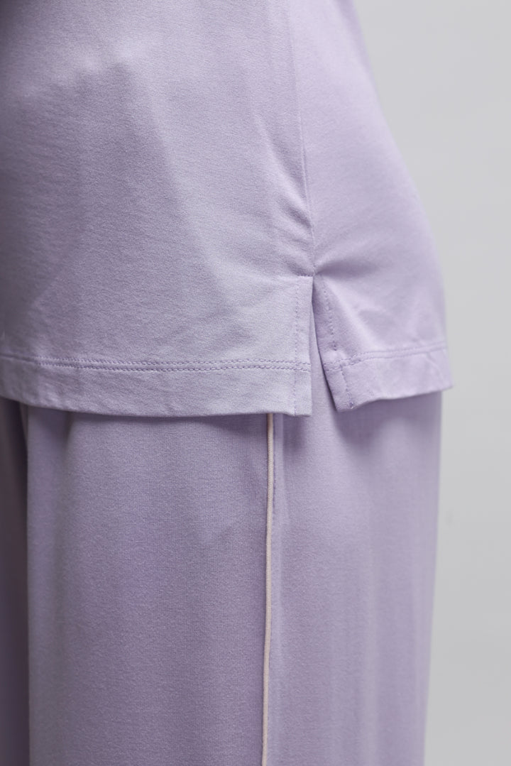 Lavender tank top showcasing soft fabric and stylish design.