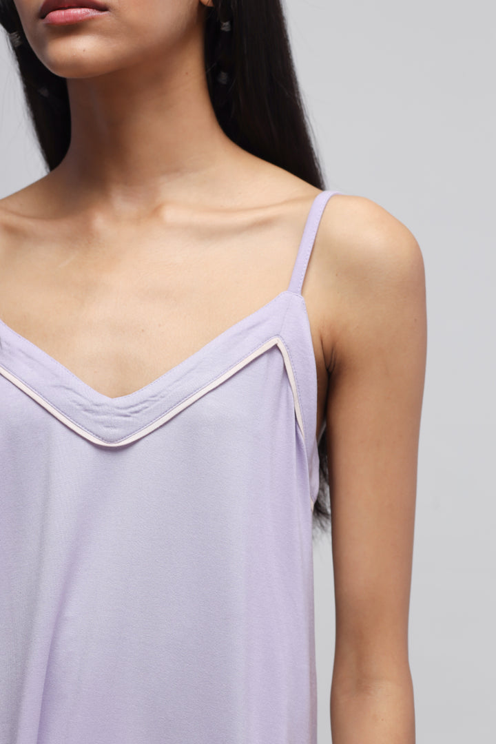 Lavender tank top with delicate straps and stylish neckline.