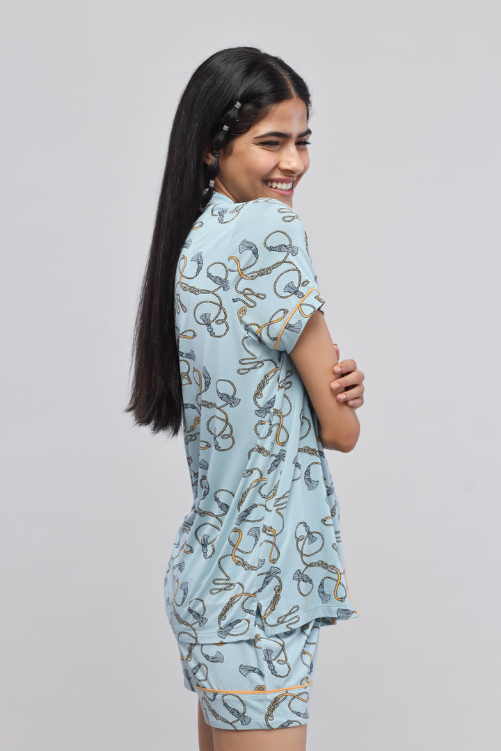 Rope printed half sleeve top with piping details on a model.