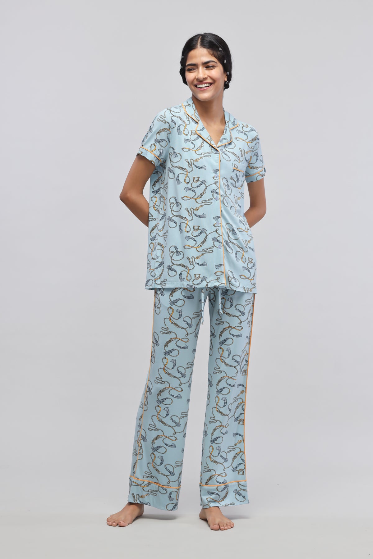 Rope printed half sleeve pajama set model posing in casual wear.