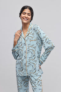 Rope printed full sleeve piping top on a model smiling.