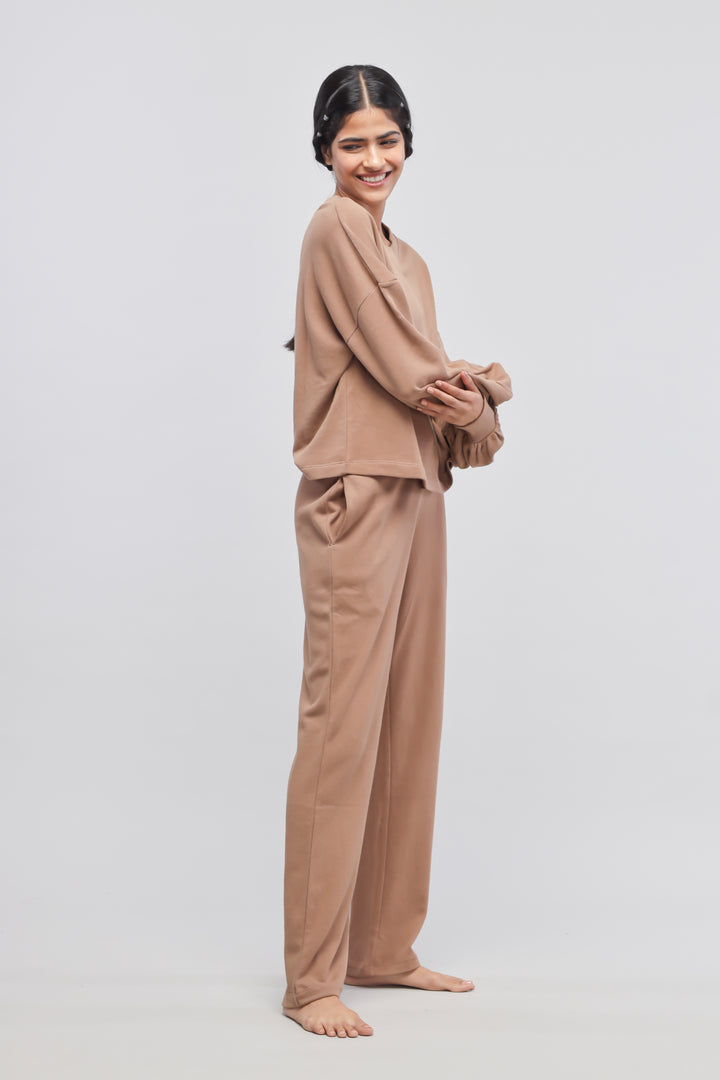 Brown terry puffed sweatshirt model showcasing comfortable loungewear style.