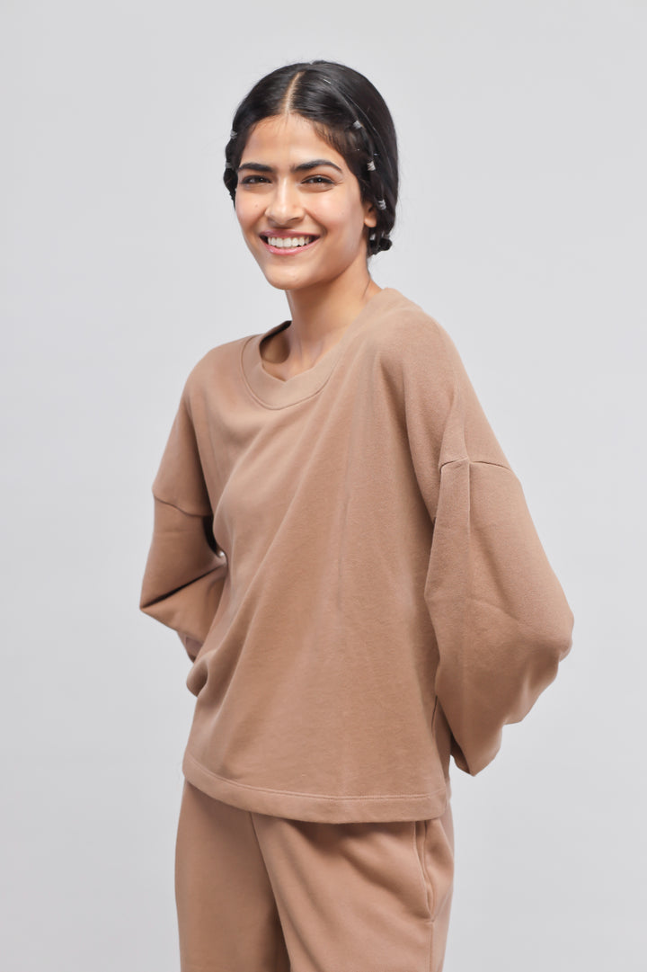 Brown Terry Puffed Sweatshirt on model, casual and stylish look.