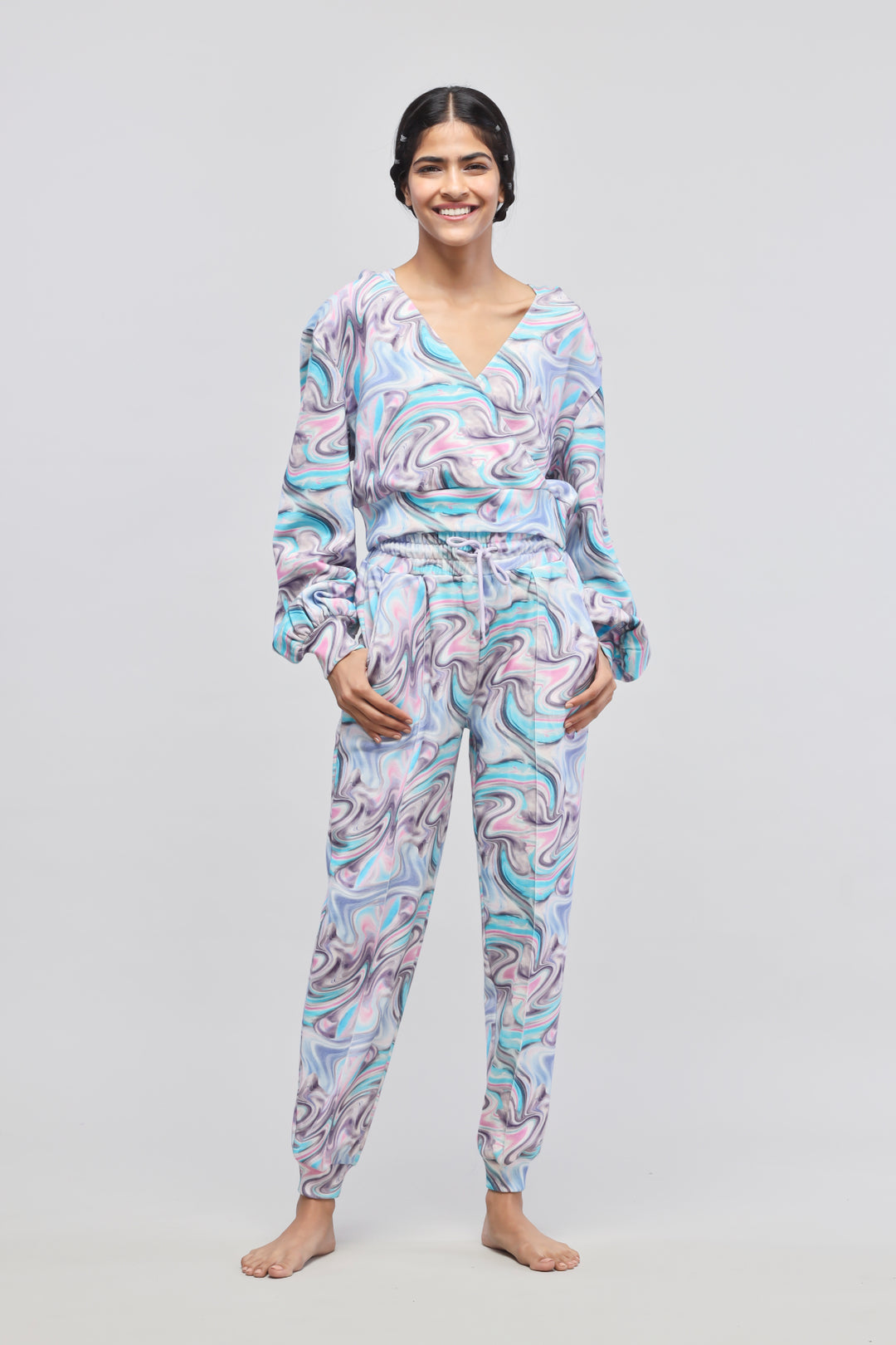 Stylish Fluid Terry Joggers in colorful swirl pattern, perfect for lounging.