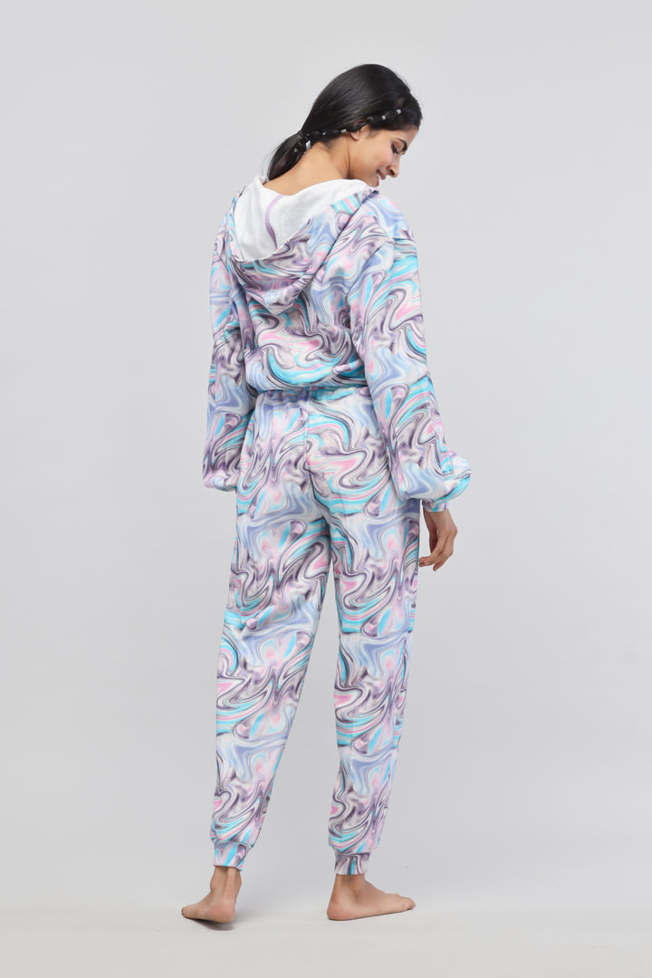 "Model wearing Fluid Hoodie Co-ord Set in colorful swirl design"