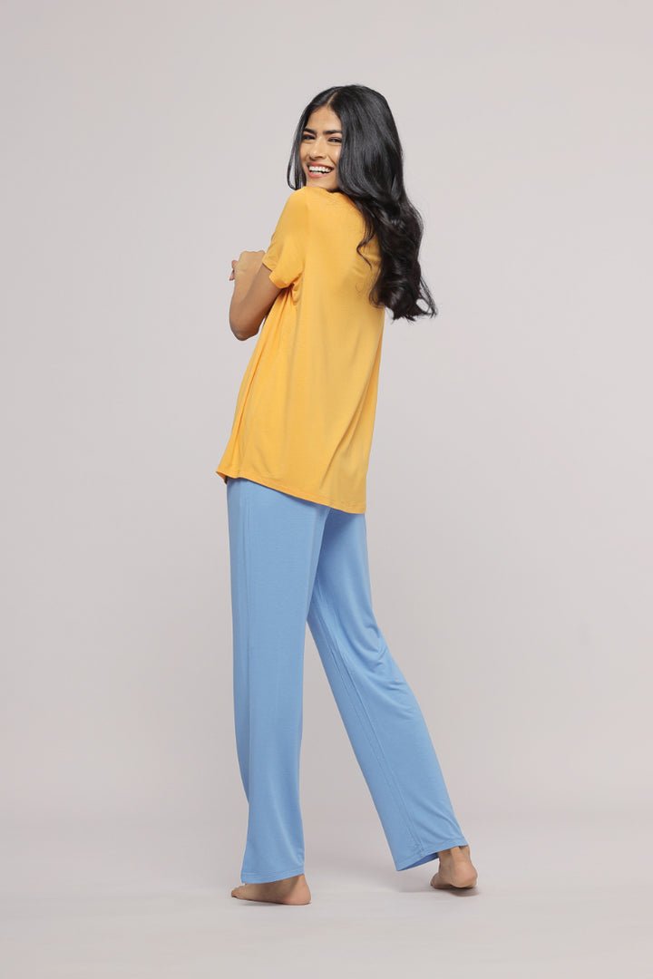 Model showcasing Cozy Blue Straight Lounge Set in yellow and blue.
