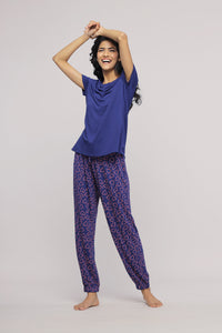 Blue Heart Pajama Set featuring a happy model in comfortable sleepwear.