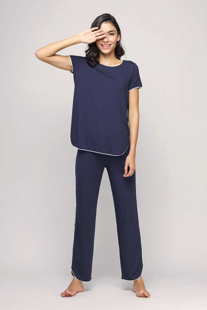 Model showcasing Love Sleep Piping Pajamas Set in navy color.