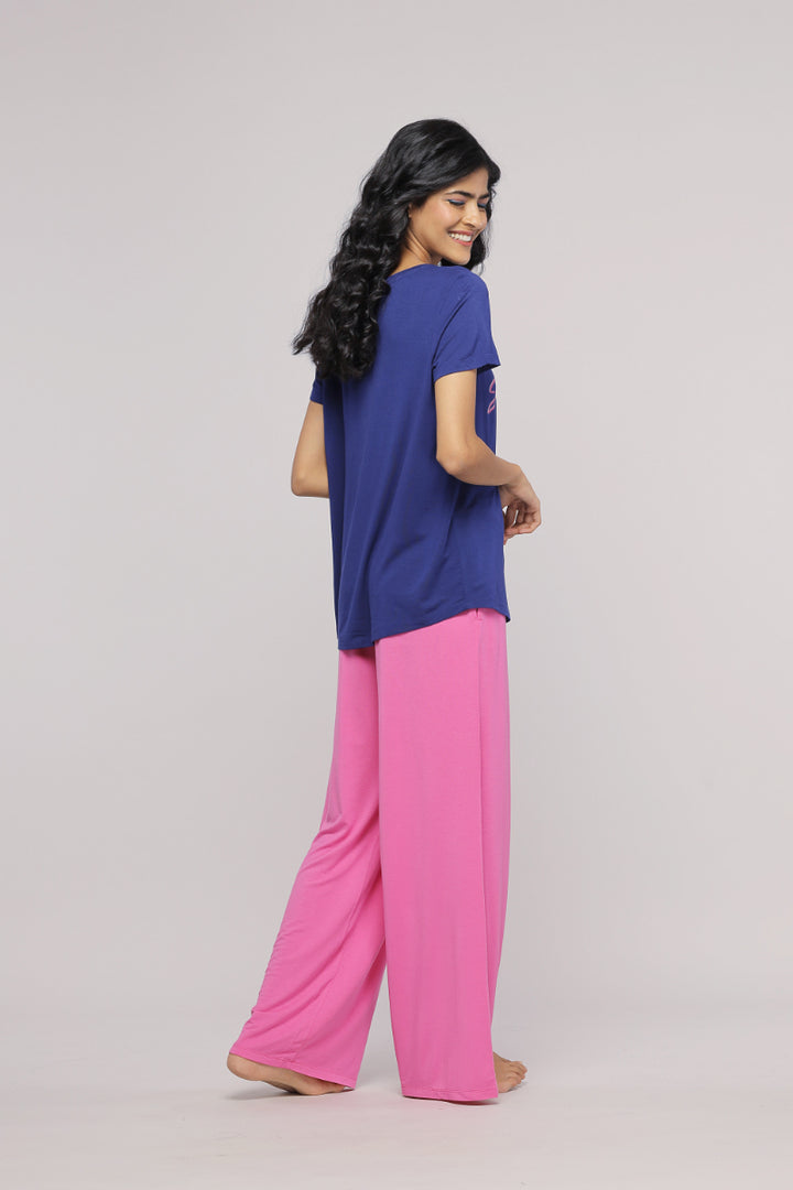 Professional Sleepyhead flared pajama set in vibrant pink and navy blue.