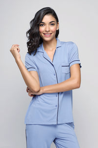 Classic blue button-down top with stylish short sleeves.