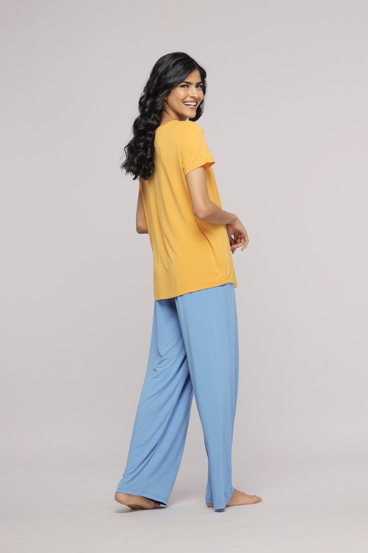 Cozy blue flared lounge pajama set with yellow tee, perfect for relaxation.