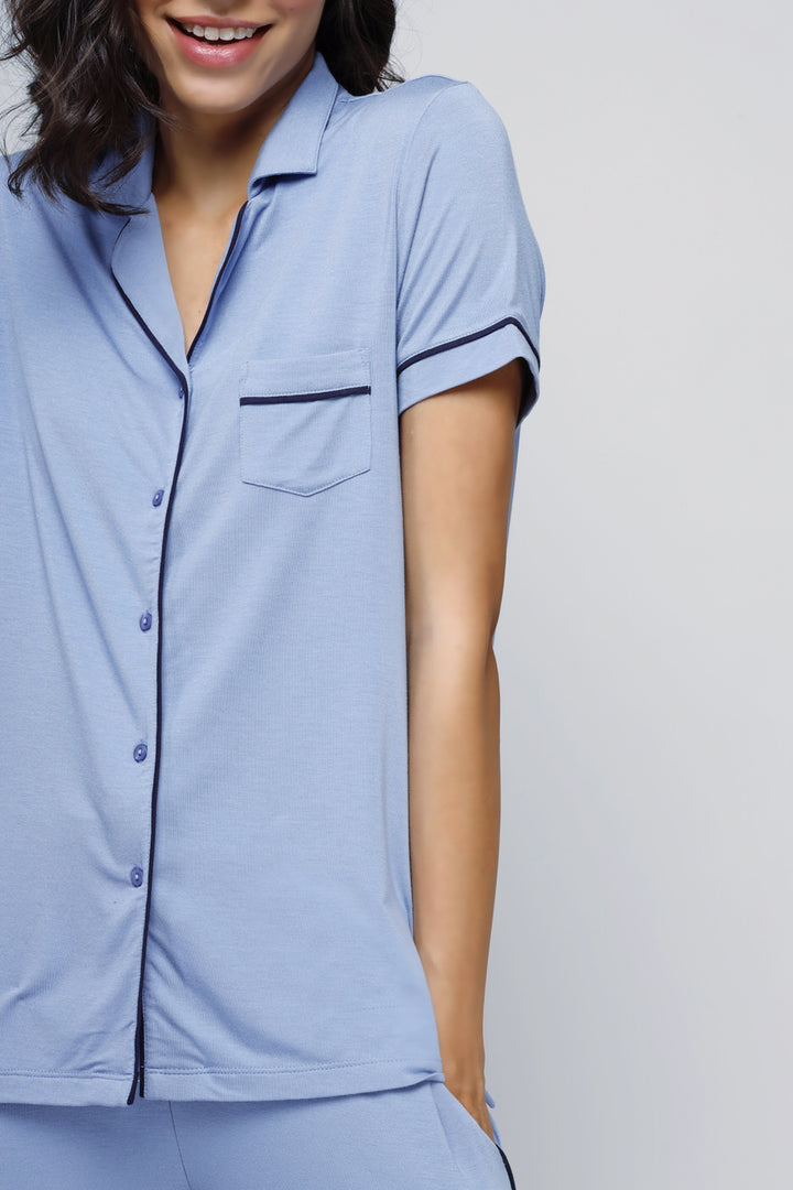 Classic blue button-down top, comfortable and stylish casual wear.