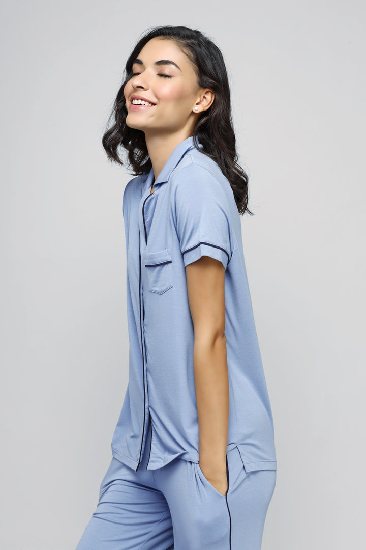 Classic blue button-down top, stylish and comfortable for any occasion.