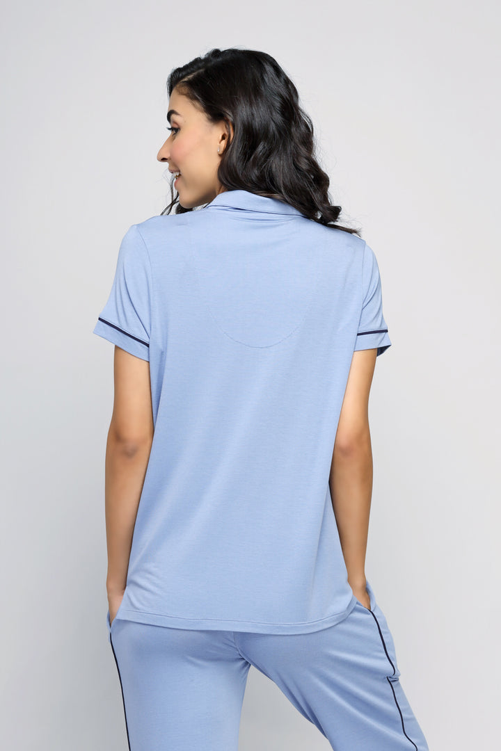 Classic blue button-down top, back view model wearing casual attire.