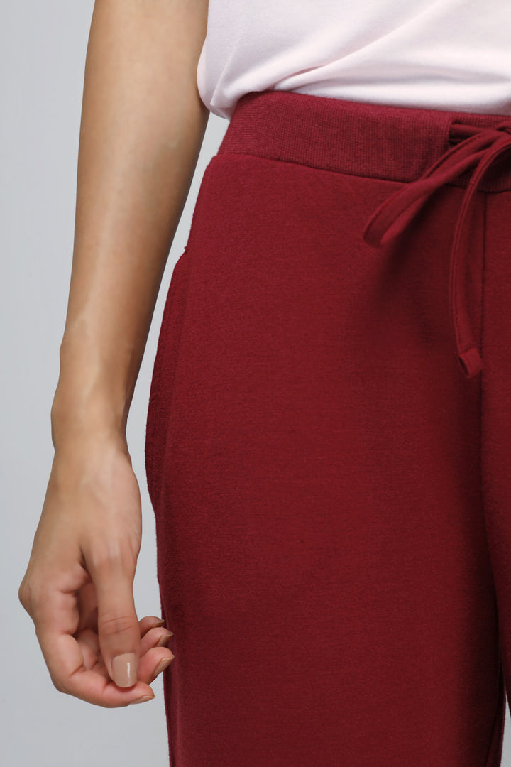 Close-up of Energise Jogger Set in burgundy with stylish fit.