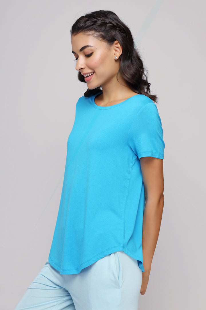 Effortless Blue Top worn by a smiling model, ideal for casual wear.