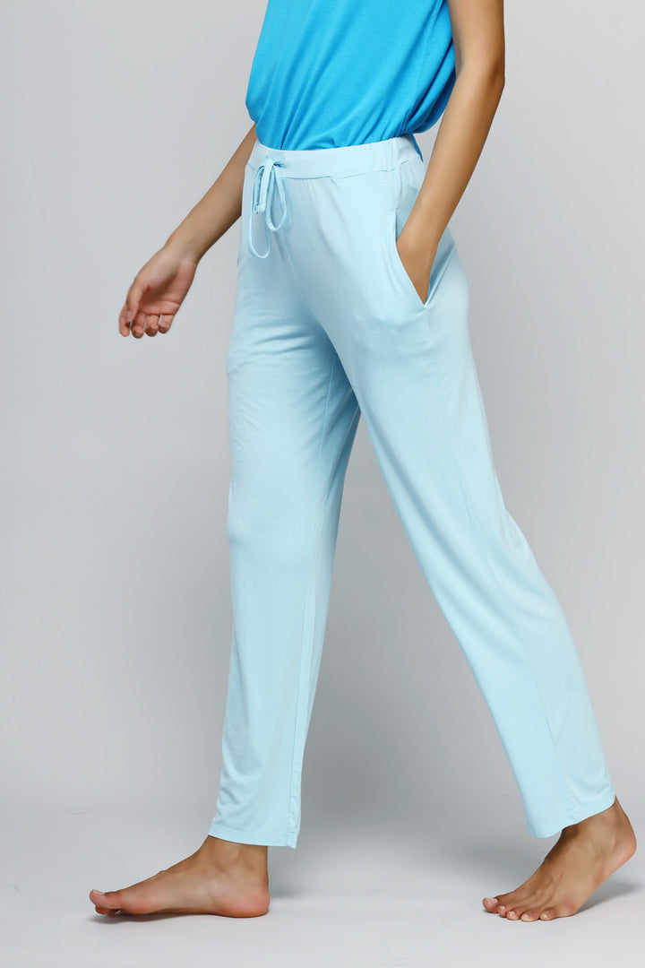 Woman wearing breezy blue straight lounge set, showcasing comfort and style.