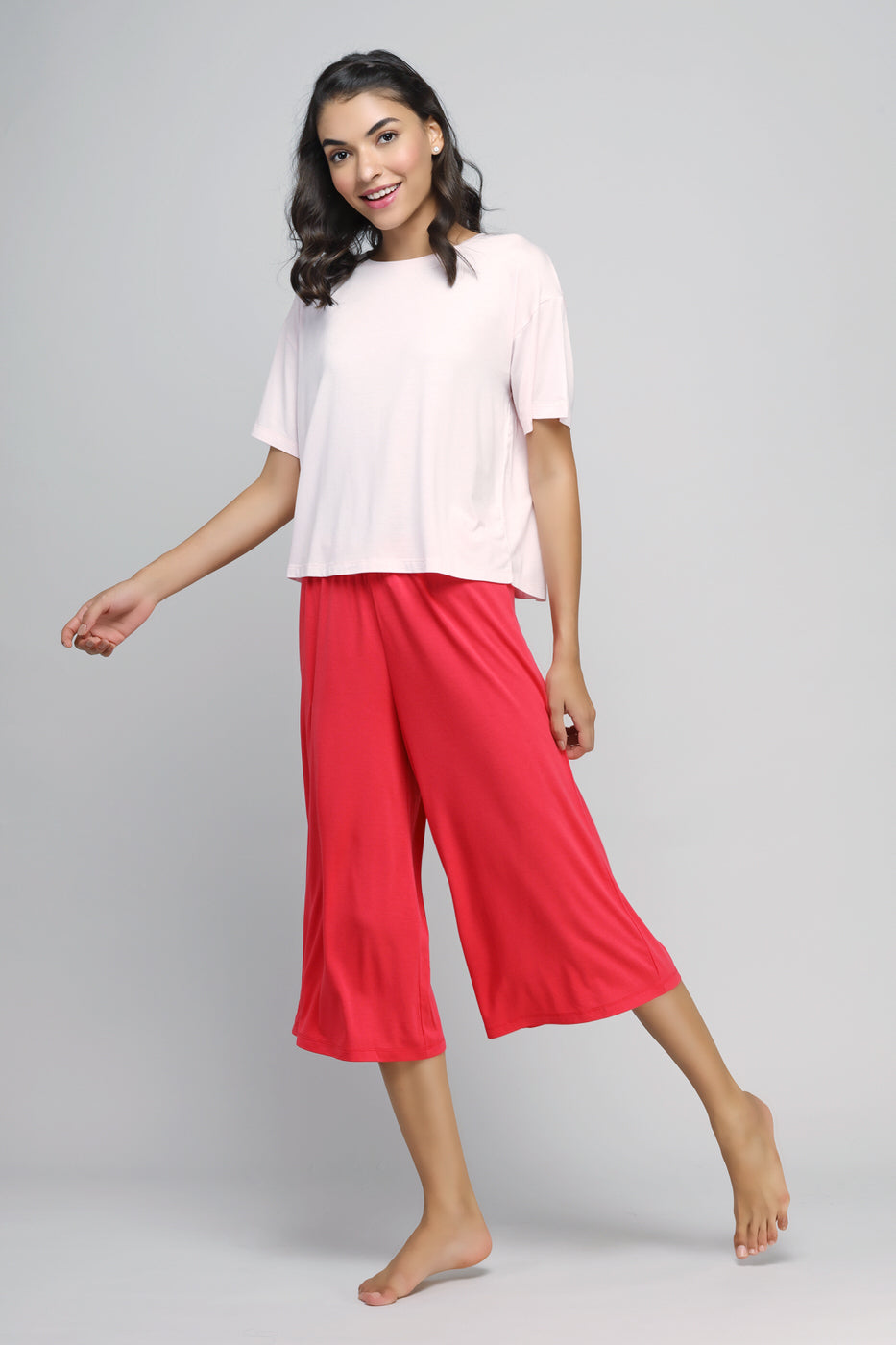 Model showcasing stylish Love Red Culottes with a casual top.
