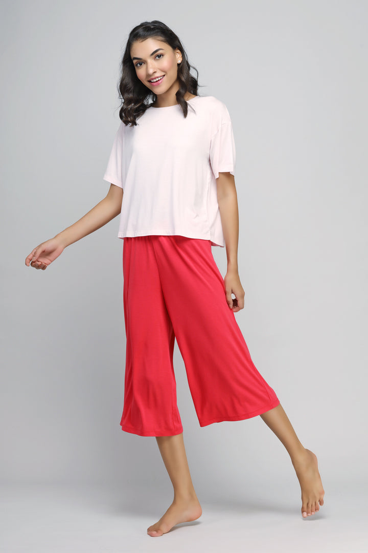 Model showcasing stylish Love Red Culottes with a casual top.