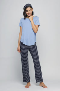 Calming blue pajama set with stylish patterned pants and comfy top.