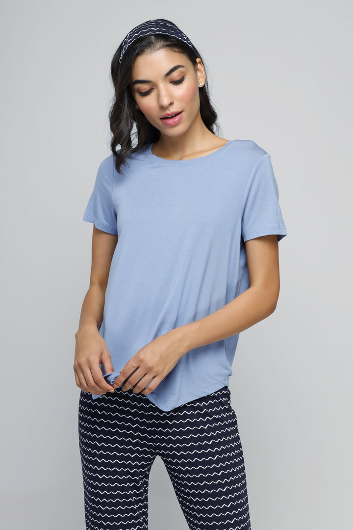 Calming Blue Pajama Set with stylish top and patterned pants.
