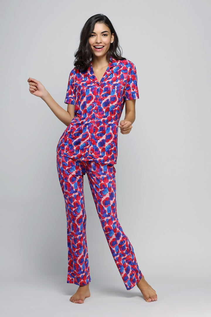 Artsy watercolor button-down pajama set in vibrant pink and blue design.