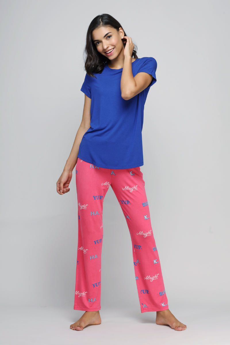 "Sure Ok Pajamas with blue top and pink patterned pants."