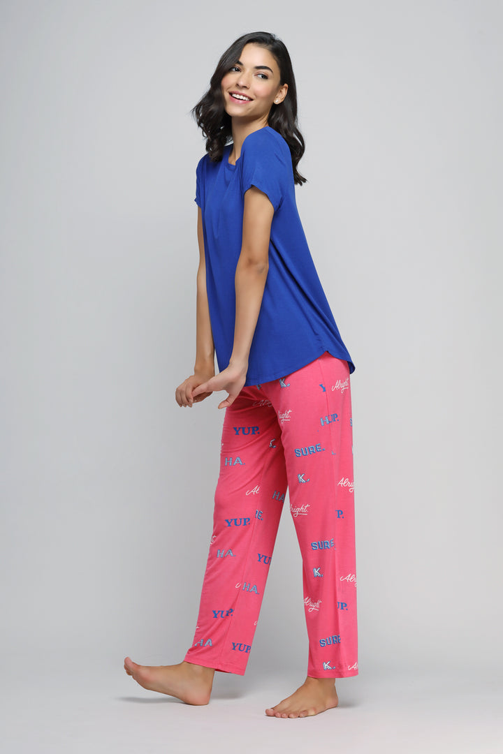 "Sure Ok Pajama Set featuring blue top and pink patterned pants."