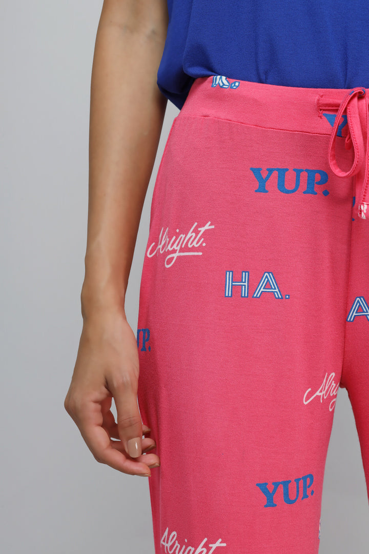 Colorful pink pajama set featuring playful text designs for relaxation.