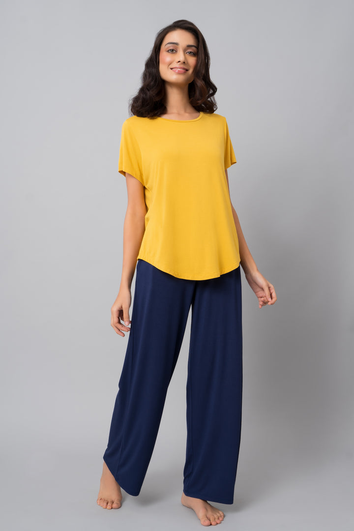 Indigo flared lounge set featuring yellow top and navy pants.