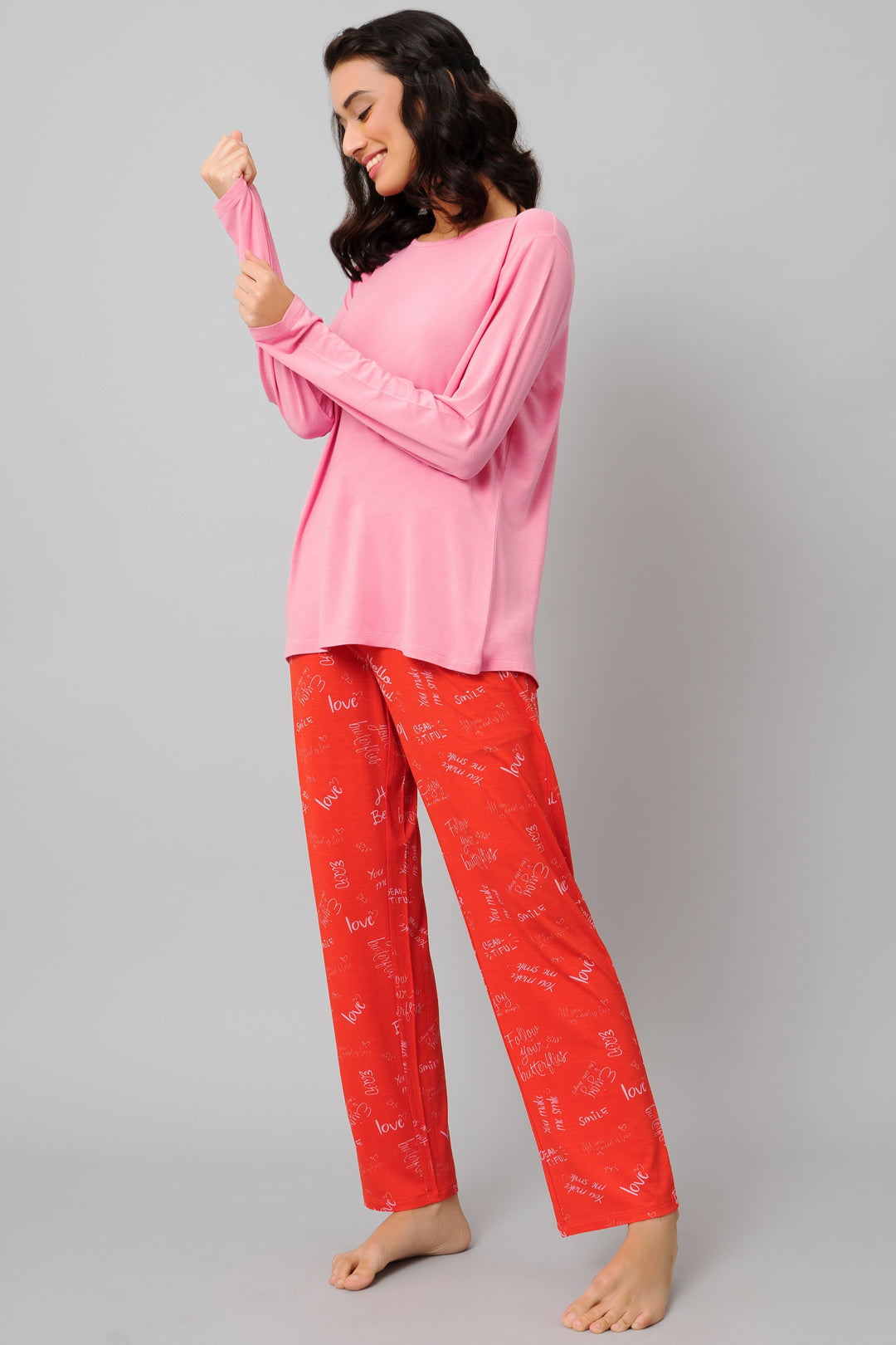 Casual pink top and red pajama set for women.