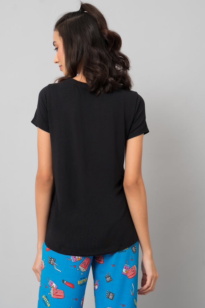 Everyday Black Capri Set featuring a stylish black top and colorful pants.