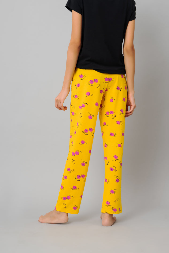 Colorful Fuffy Kitty Pajamas with floral pattern and black top.