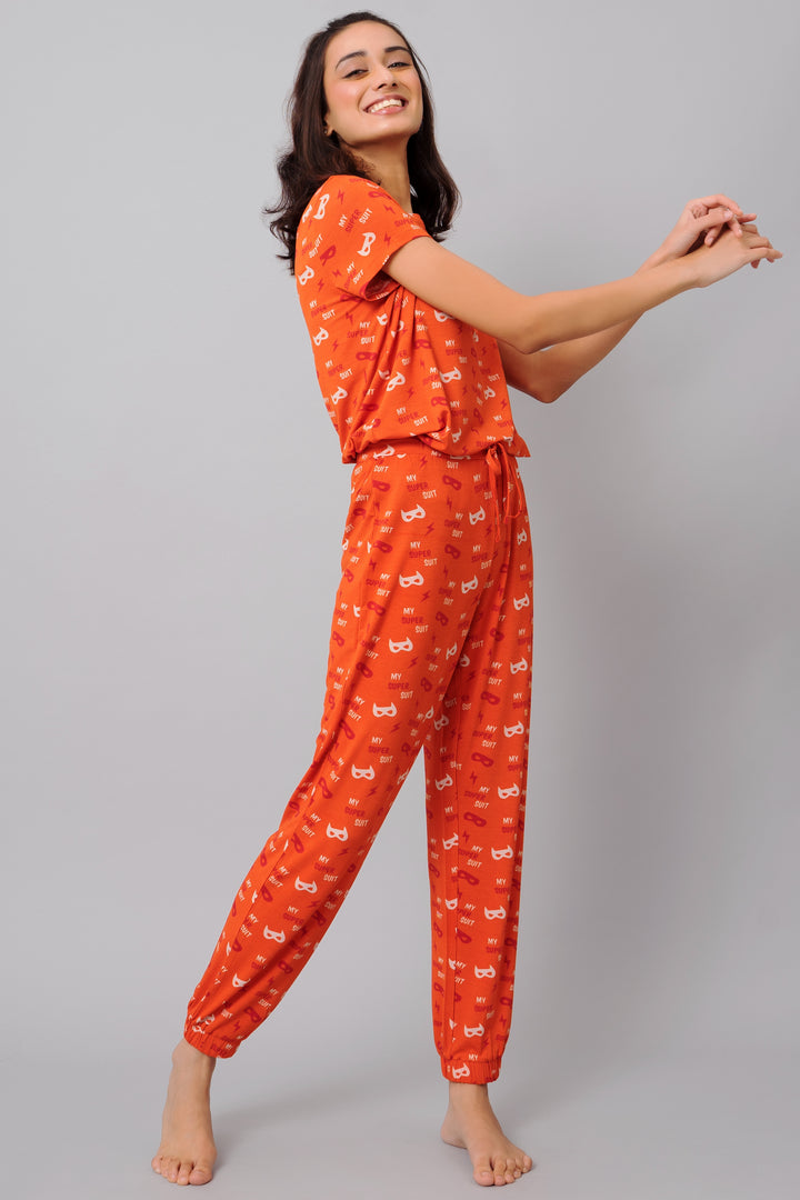 Bright orange Super Suit Top with playful print, perfect for comfort and style.